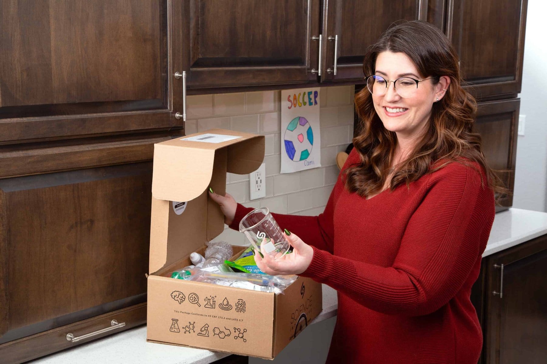 Student Unboxing Physical Science Lab Kit